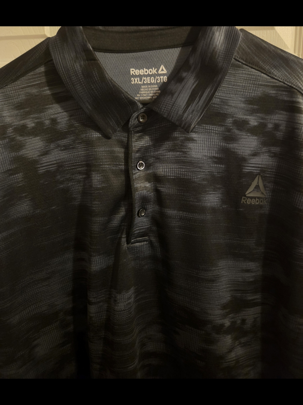 Reebok Men’s Black and Dark Gray Patterned Polo